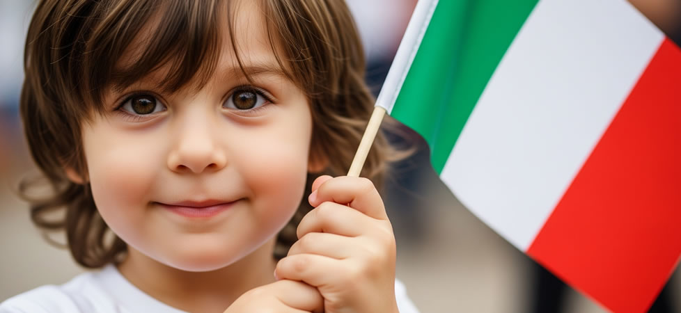 Little boy smiling and holding italian flag